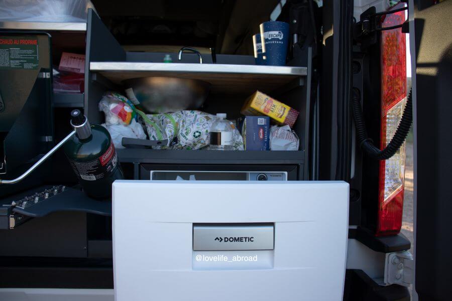 Escape Campervan The kitchen area with a solarbattery powered Dometic fridge