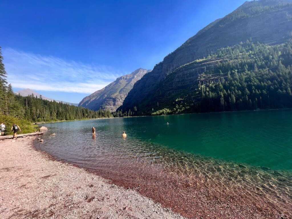 Enjoying Avalanche Lake after a hike Photo credit Postcard from Carrie 