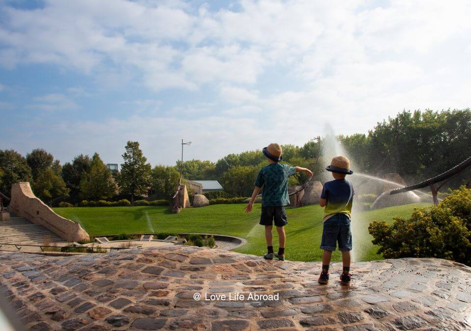 Kids exploring the Forks National Historic Site in Winnipeg