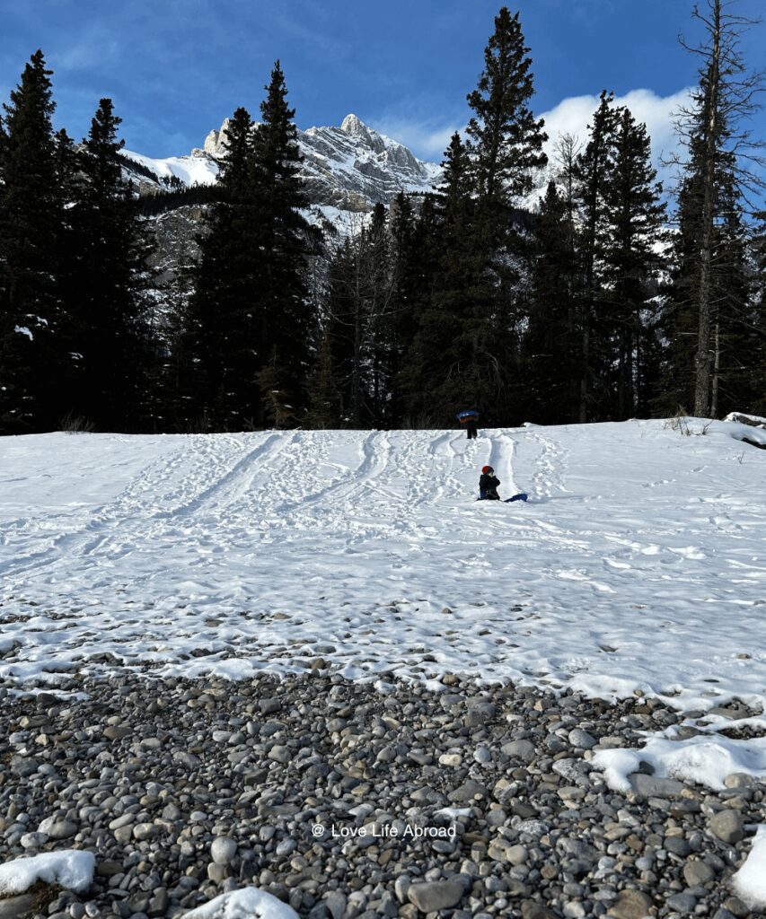 Sledding at Cascade Ponds in Banff in November