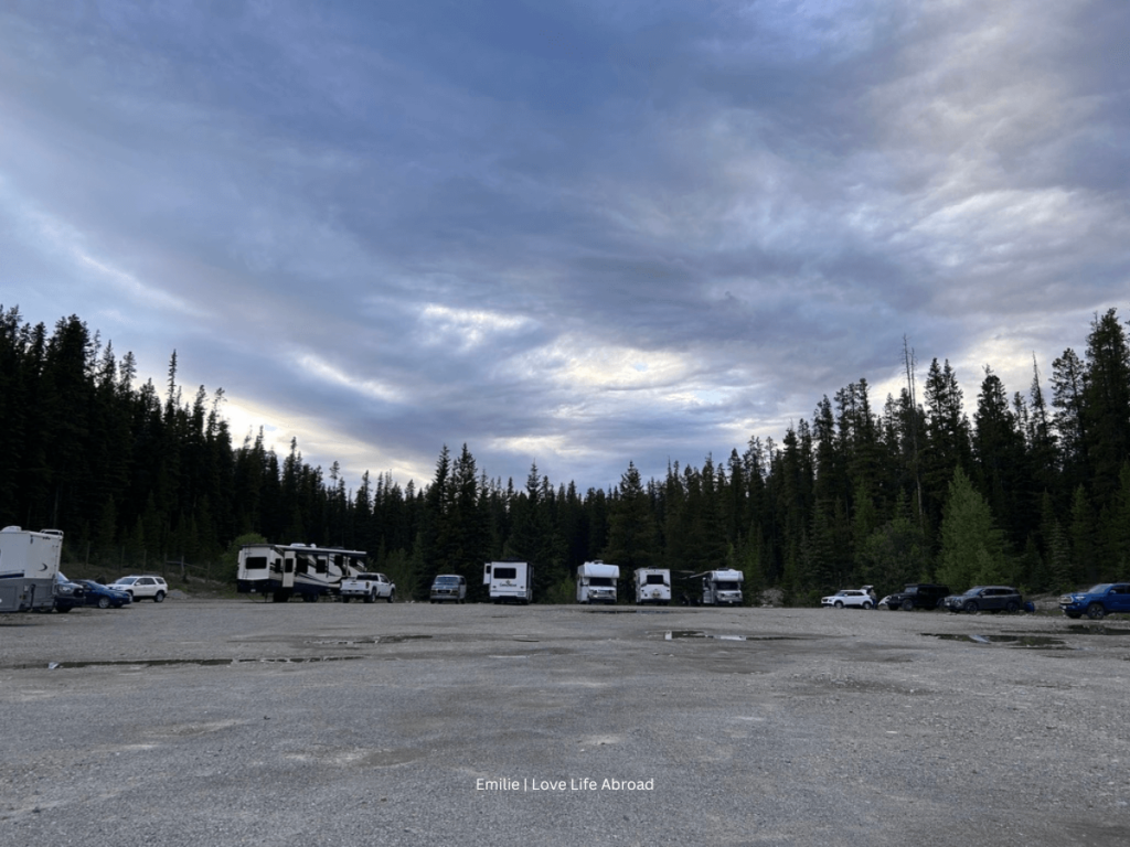 RVs parked next to each other in the early evening at the First-come-first-serve campground at the Lake Louise overflow