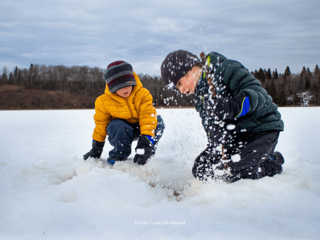 Enjoying the snow on Lacombe Lake at Kuhnen Park