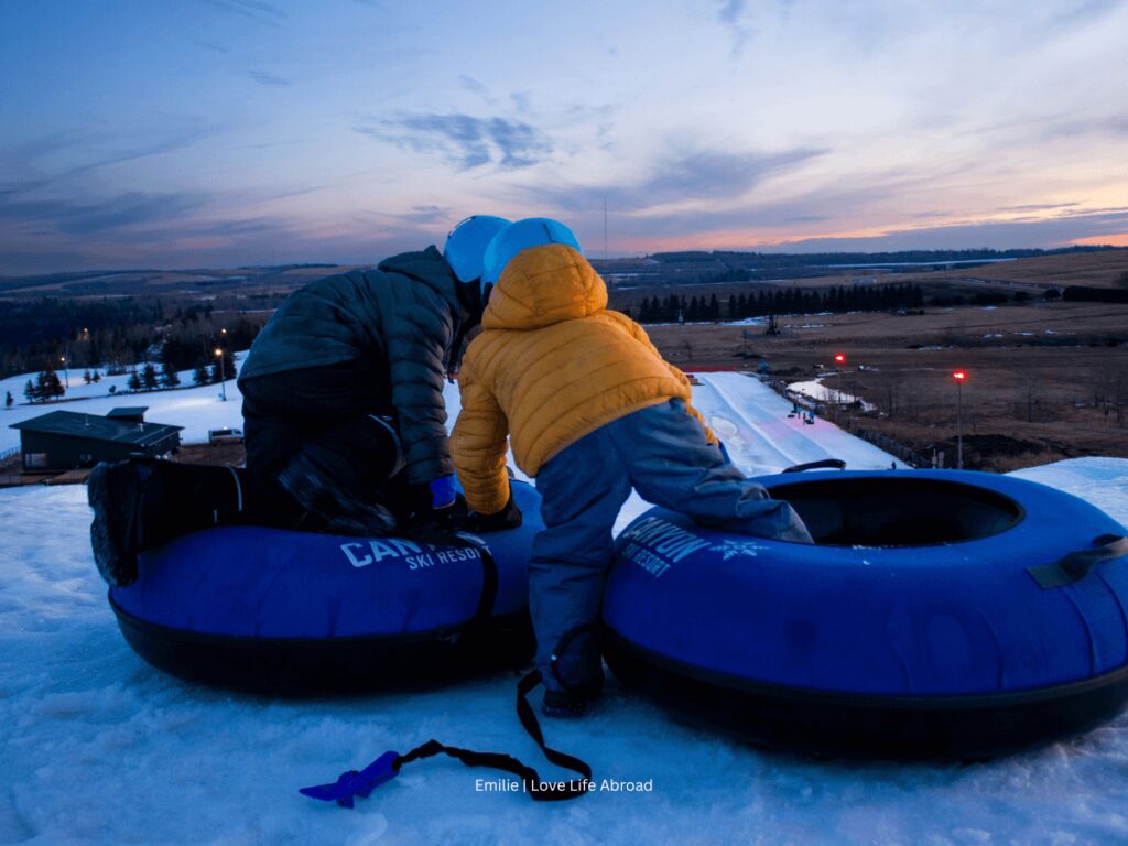 Evening snow tubing at Canyon Ski Resort. The kids are getting ready to go down the hill alone