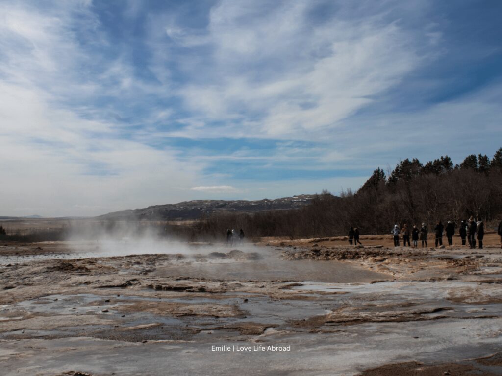 Waiting for the geyser Strokkur to erupt at Geysir area